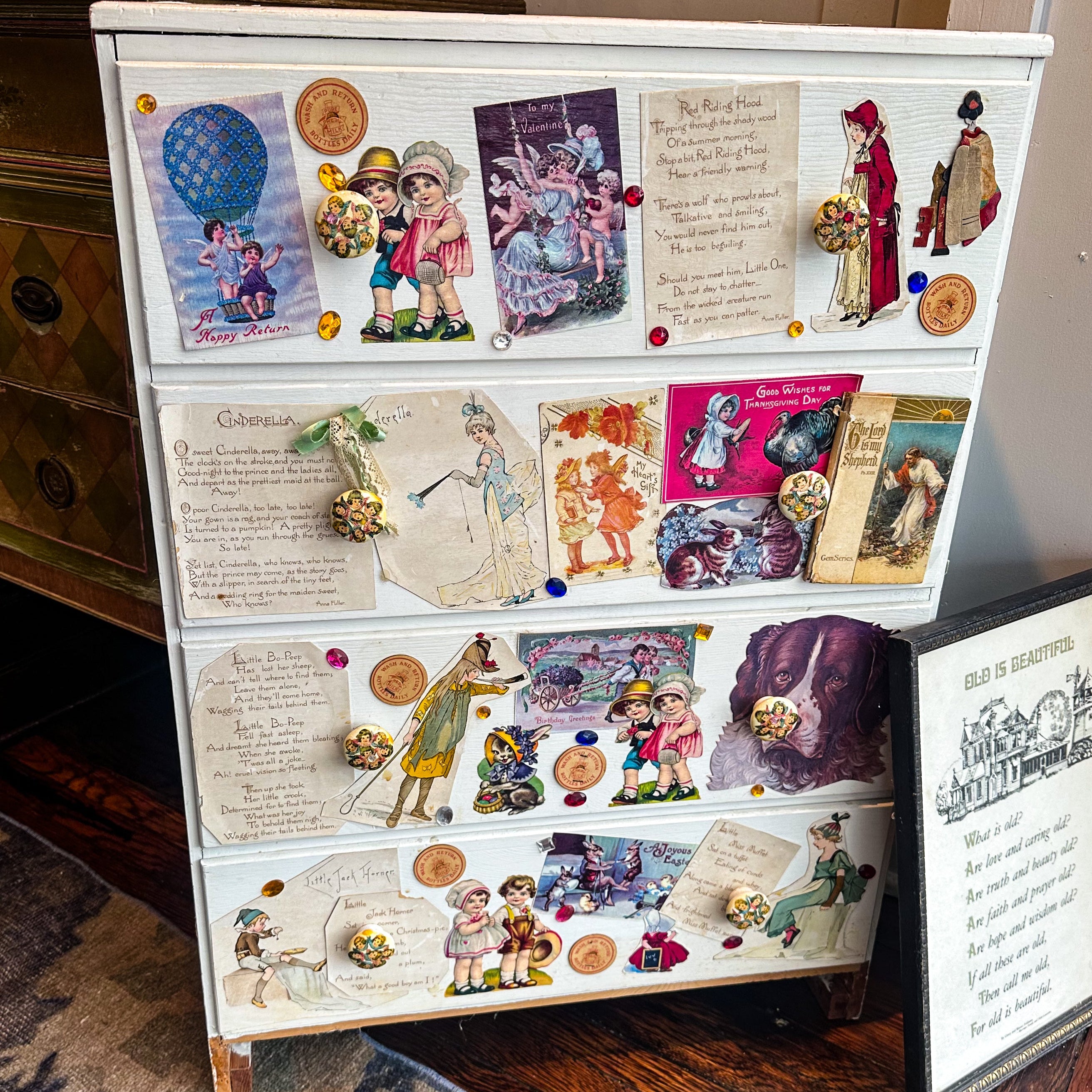 Furniture with vintage-style illustrations and text on a wooden floor.
